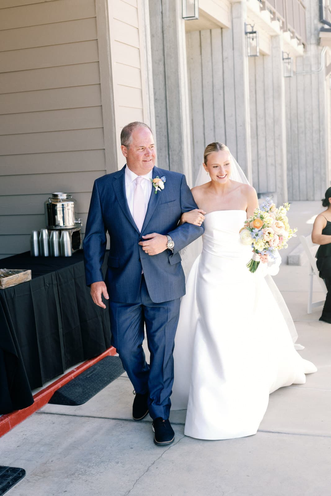 A father walking his daughter down the aisle at a Salt Lake City wedding