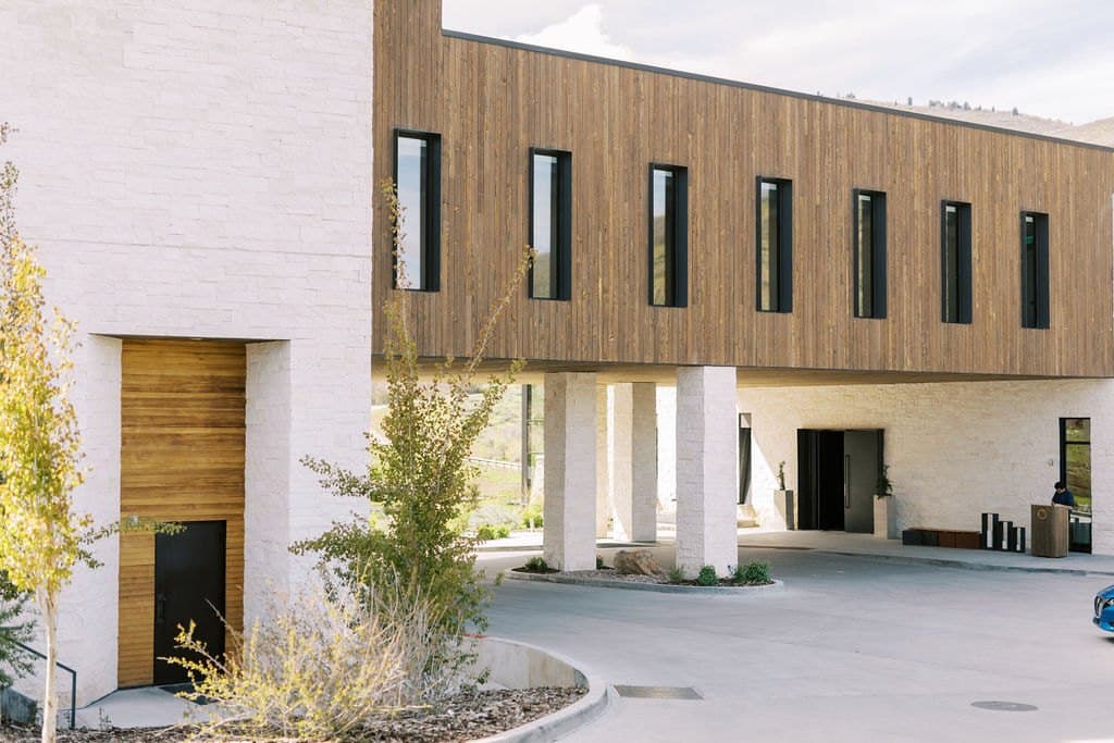 The modern wood and white stone entrance of a Park City wedding venue