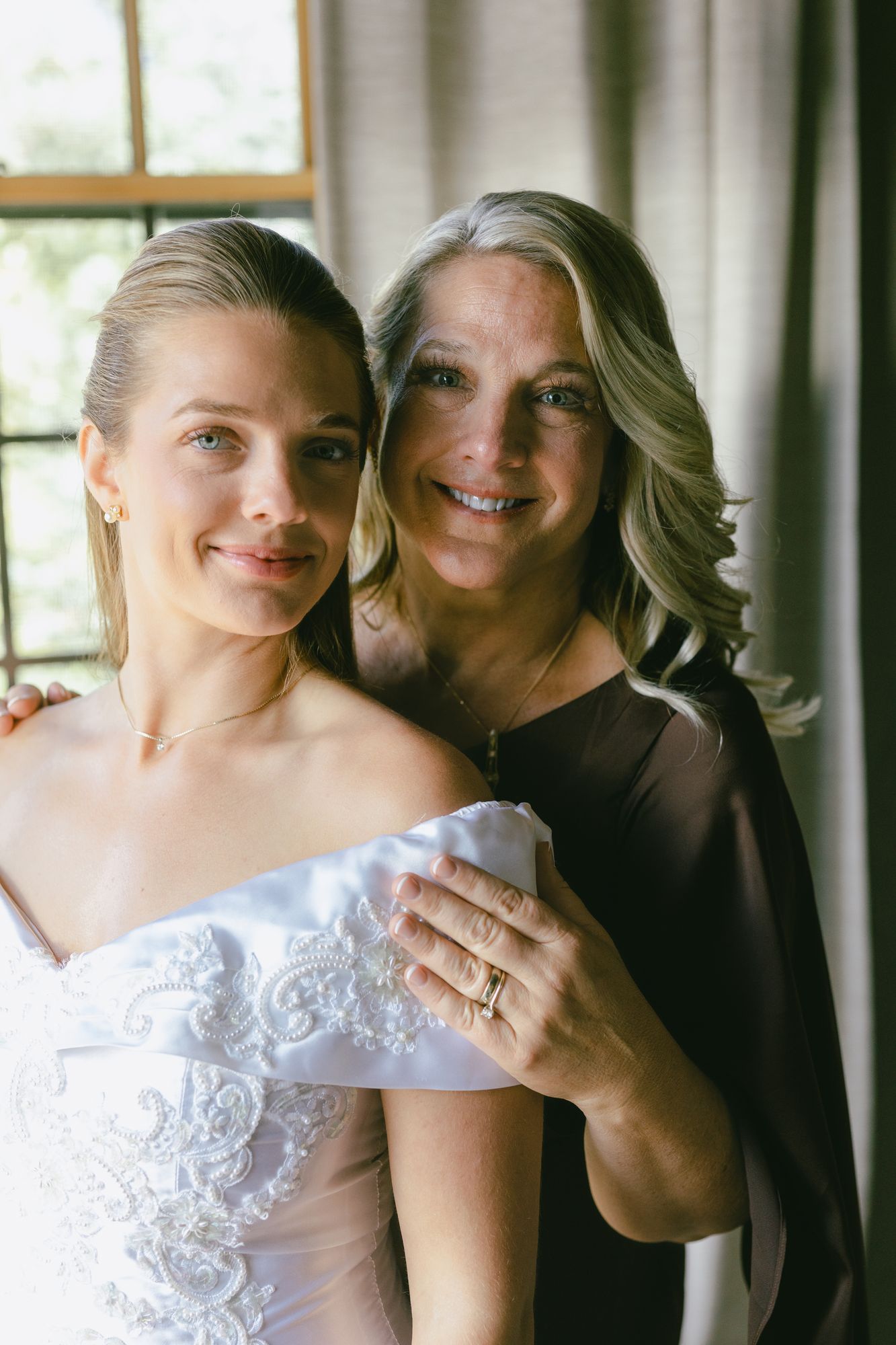 Marita and her mother together at the window before the ceremony